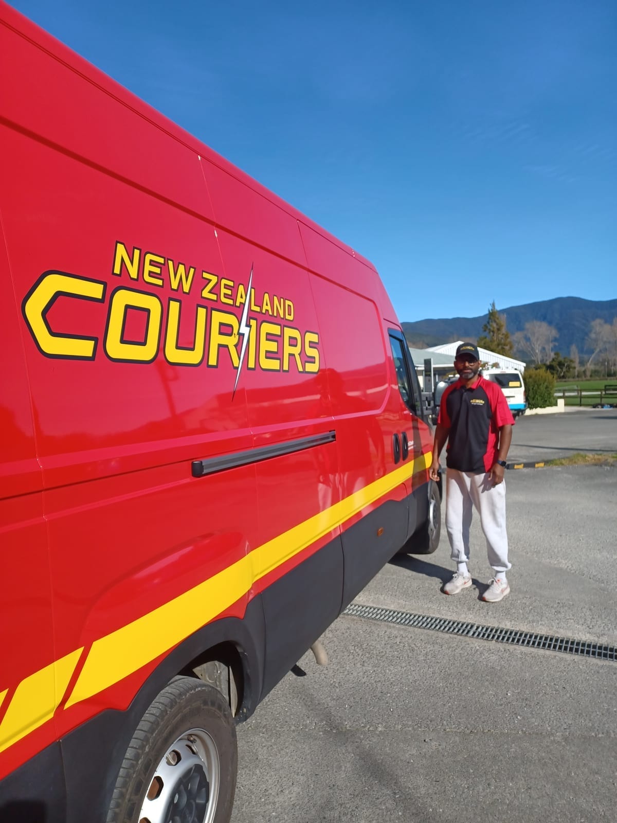 New Zealand Couriers van used for parcel pickup and drop-off at Unlimited Copies Takaka